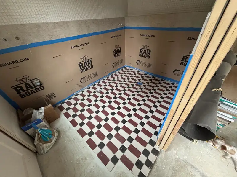 Checkerboard floor tile set in the bath, floors protected