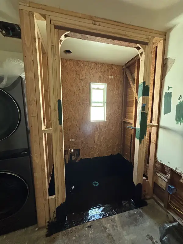 New framing and a waterproofed shower floor going in