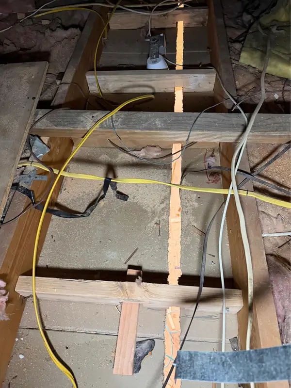 New wiring run through the open ceiling joists for the track lighting