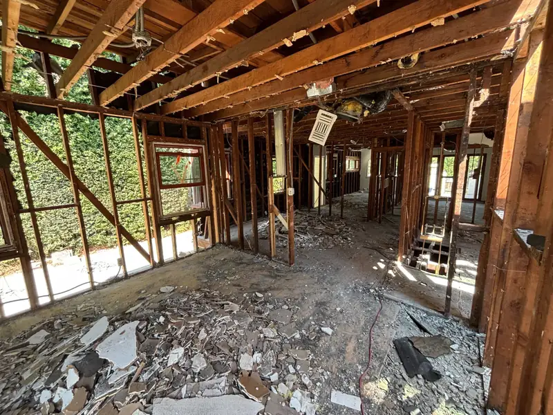 The main floor gutted to the framing, ceilings and walls open