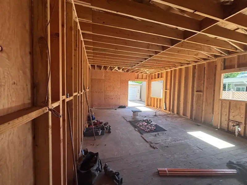 The framed great room, with window and door openings