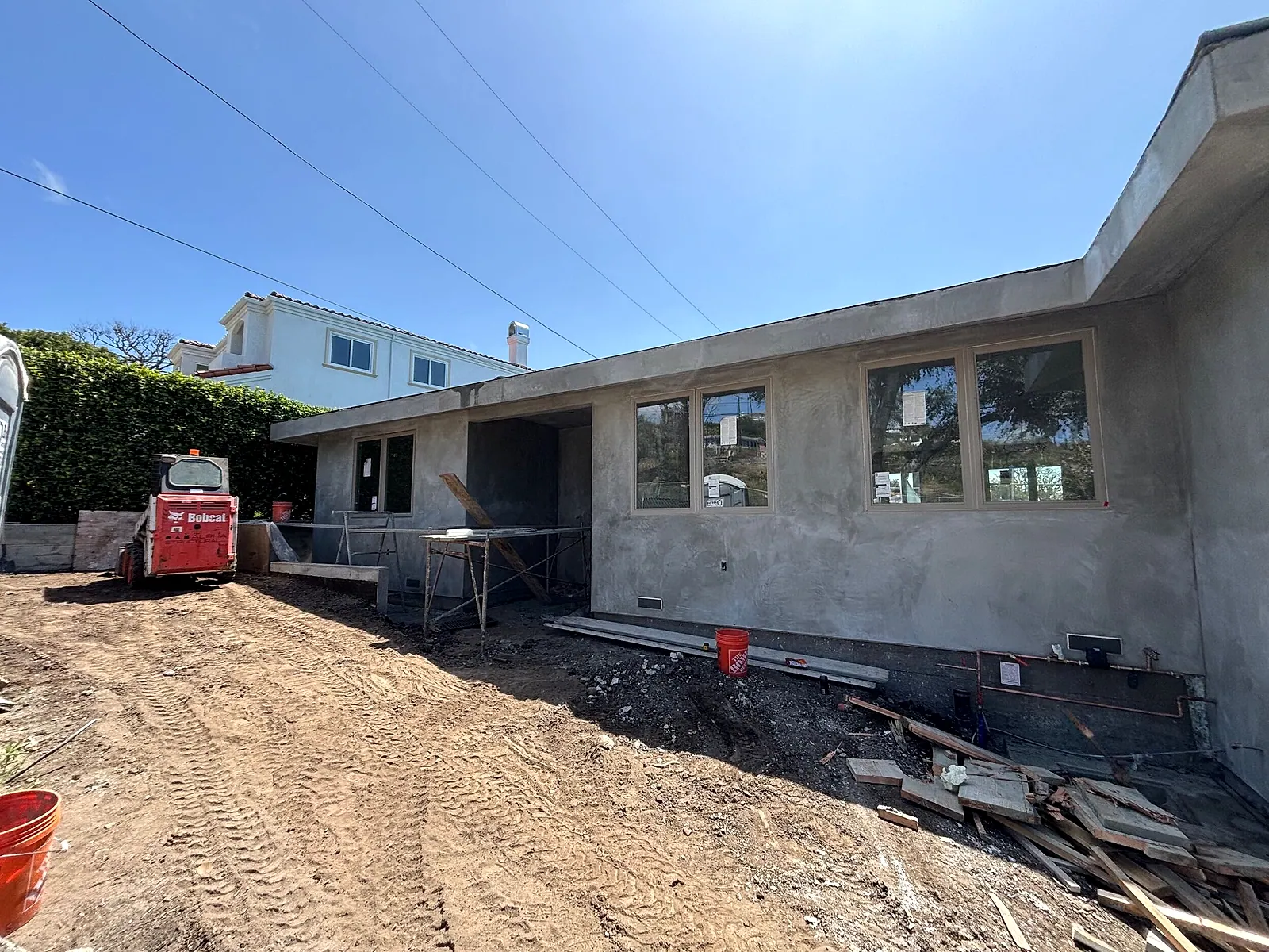 Home addition under construction with new walls and windows