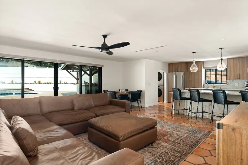 Living room with sectional sofa open to the kitchen and dining area